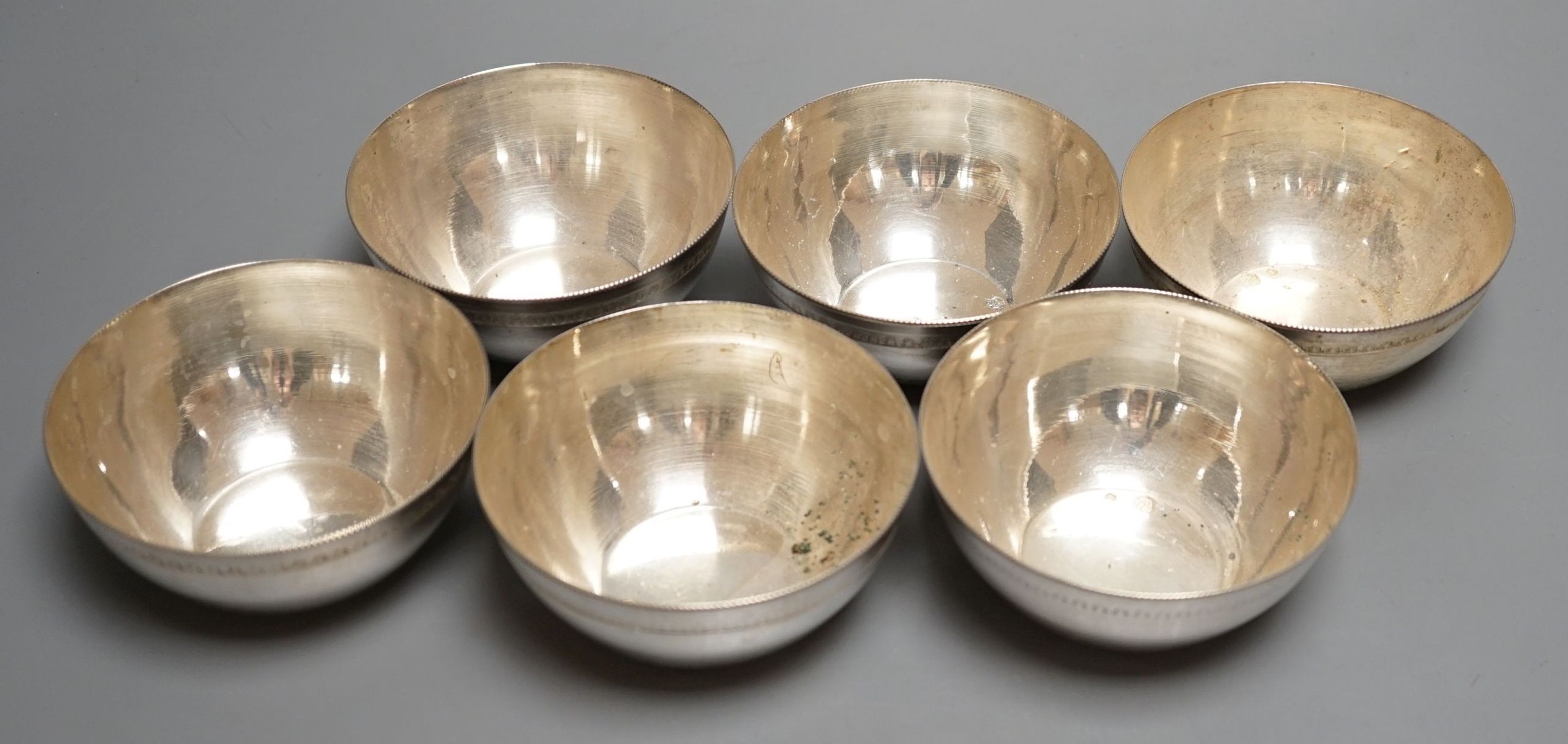 A set of six 20th century Egyptian white metal finger bowls, 10.3cm, 17.5oz.